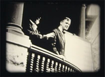 Image of Andrew Taylor Still on a balcony with student