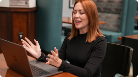 A Person on video call talking to a computer