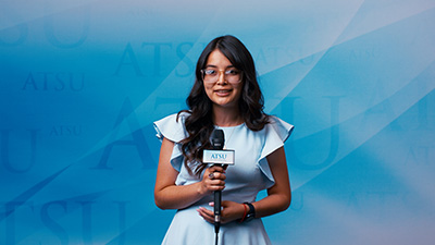 Student speaking into microphone