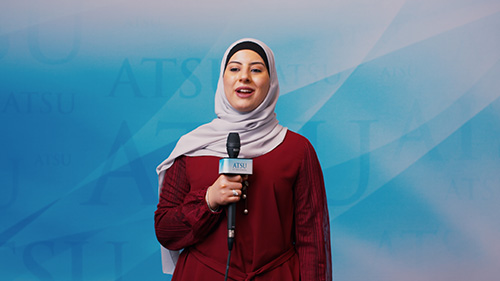 Student speaking into microphone