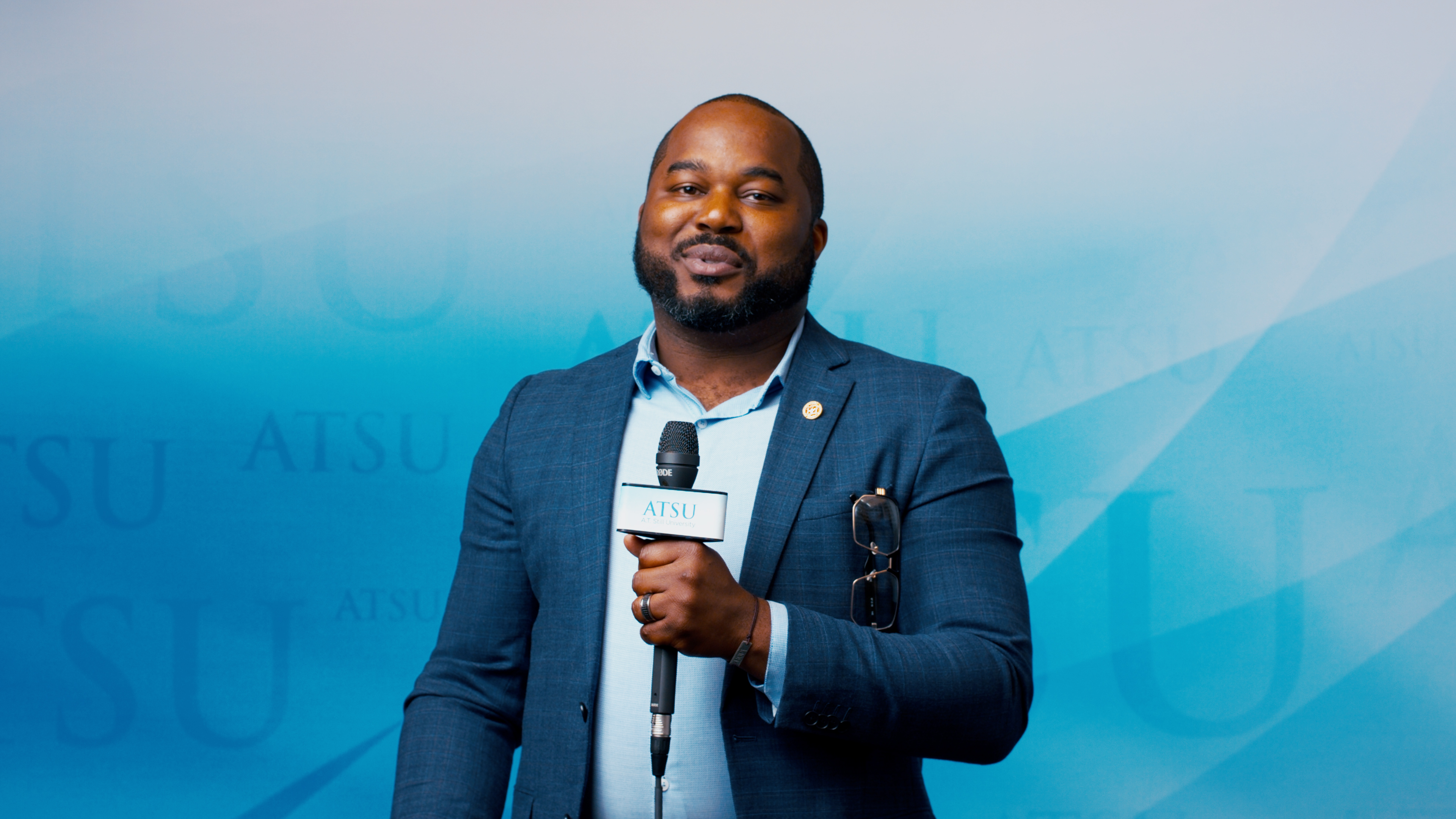 Student speaking into microphone