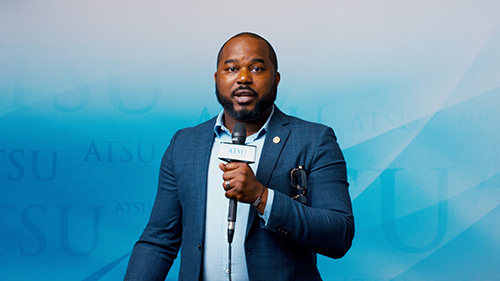 Student speaking into microphone